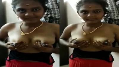 Village housewife squeezing mulai and taking milk